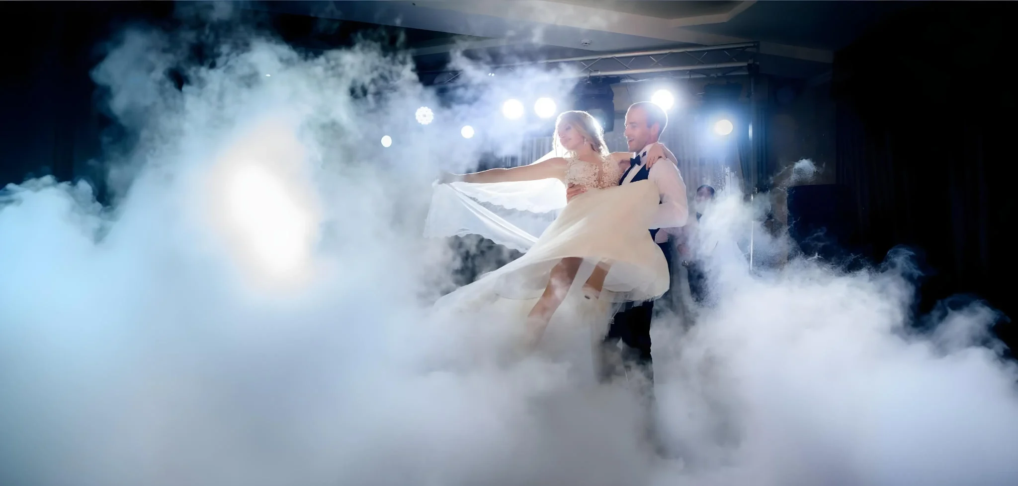 Romantic wedding stage with dreamy fog effects and soft lighting
