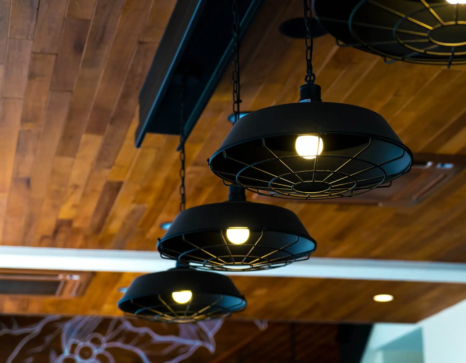 Three modern pendant light fixtures hanging from the ceiling - Types of Ceiling Lights: Get the Right Choice for Your Home - Vorlane